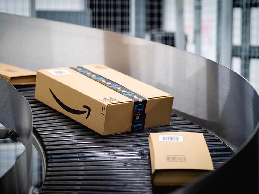 An Amazon box on a conveyor belt