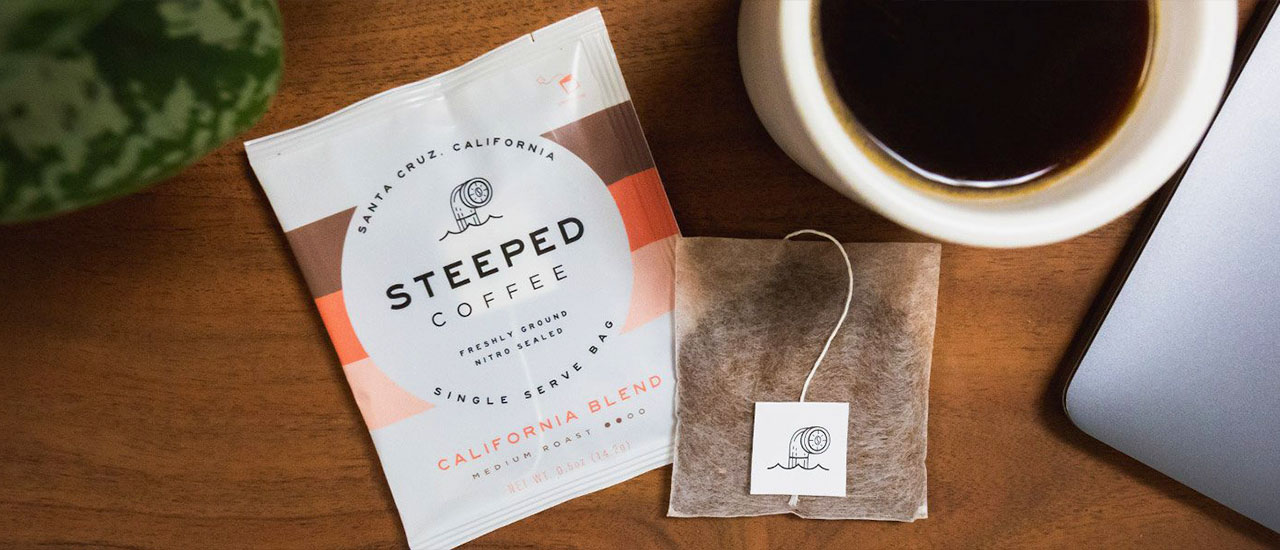 Steeped coffee bag and a cup of coffee